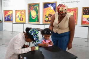 Children enjoying hands-on activitoes at the 'Home Sweet Home' Exhibition at Mall Galleries